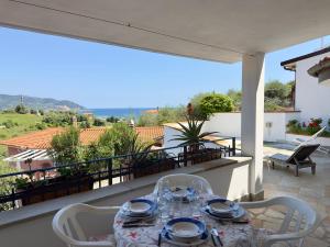 a table on the balcony of a house at Villa Thalea in Diano Marina +25 photos
