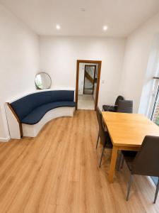 a room with a bed and a table and a mirror at Apartment Rahden in Rahden +7 photos