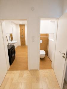 a bathroom with a toilet and a sink at Apartment Rahden in Rahden