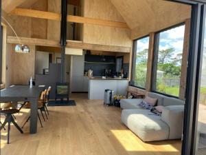 a living room and dining room of a house at Wooden architect-designed house in Camaret-sur-Mer
