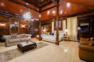 a large living room with a couch and a tv at Urbanview Onengan Resort in Palang-Putih +136 photos