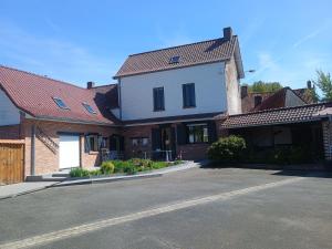 a house with a driveway in front of a building at demeure à la campagne in Conchy-sur-Canche +16 photos