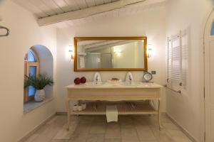 a bathroom with a sink and a mirror at Oliviera Private Island Hotel - Kalem Island in Kalem Adasi +137 photos