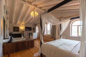 a bedroom with a bed and a bath tub at Oliviera Private Island Hotel - Kalem Island in Kalem Adasi