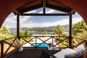 a view from the porch of a resort with a view of the ocean at Oliviera Private Island Hotel - Kalem Island in Kalem Adasi