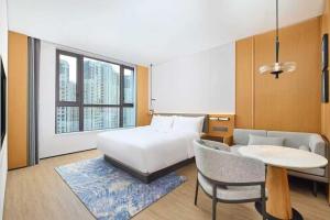 a hotel room with a bed and a table at Fairfield by Marriott Ningde Xiapu in Xiapu +50 photos