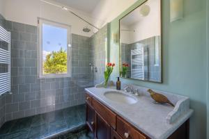 a bathroom with a sink and a mirror at La dolce riva - lake Cottage in Onno +37 photos