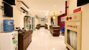 a hospital hallway with a waiting room and a pharmacy at Subwow Hostel in Bandung