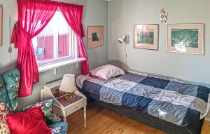 a bedroom with a bed and a window at Cozy Home In Sölvesborg With Wifi in Sölvesborg +8 photos