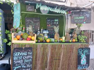 a fruit stand with fruits and vegetables on display at Wonder Charm in Albufeira