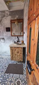 a bathroom with a sink and a mirror at Dar Nomads in Chefchaouen +122 photos