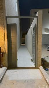 an empty hallway of a building with a door at Apartment in Al Kharj