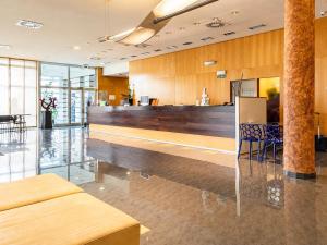 a lobby with a bar in a building at Hotel Andia in Orcoyen