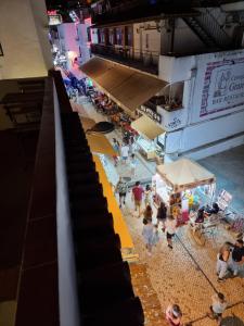 an overhead view of a crowd of people in a swimming pool at Wonder Charm in Albufeira +33 photos