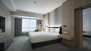 En eller flere senger på et rom på G Hotel Gurney
