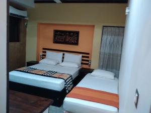 Кровать или кровати в номере Sayo Villa