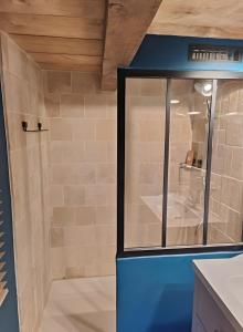 a bathroom with a shower with a glass door at Gîte Escapade À La Voreille in Mazirat +13 photos