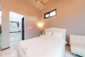 a bedroom with a large white bed and a window at Namiseom 2020 Spa Poolvilla in Chuncheon +32 photos