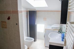 a bathroom with a white toilet and a sink at B&B Ad Un Passo Dal Mare in Montesilvano +16 photos