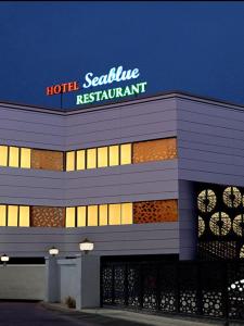 a hotelenna restaurant sign on top of a building at Hotel Sea Blue MALLAPPALLY in Vennikulam
