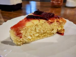 a piece of cake sitting on a white plate at Friends glamping & Sauna in Kutaisi