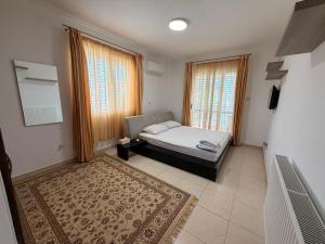 a bedroom with a bed and a large window at Villa Andy-350 m from the beach in Larnaca +43 photos