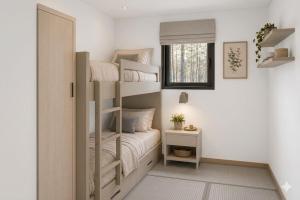 a small bedroom with bunk beds and a window at Delta Open Air Resort in Porto Garibaldi +72 photos