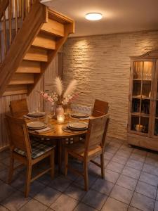 a dining room with a wooden table and chairs at Extertal Ferienpark Sauna Wald 51 in Extertal