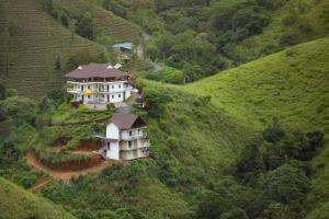 an aerial view of a house on a hill at Monkey Tribe Vagamon in Vagamon