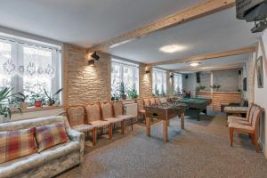 a living room with a couch and a table at Topaz in Karpacz