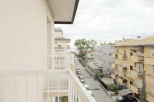 an apartment balcony with a view of a street at Hotel Mariblu in Rimini