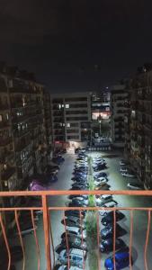 a parking lot full of cars parked in a parking lot at Scandinavian Studio Bucharest in Dudu