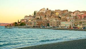 a town on the shore of a body of water at Lagò-Anguillara Sabazia in Anguillara Sabazia +6 photos