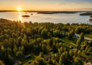 an aerial view of a river and trees at sunset at HavsBo in Västerhaninge