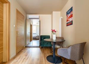 a small room with a table and chairs at Gościniec in Sopot