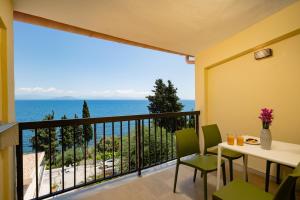 a balcony with a view of the ocean at Siora Leni Hotel in Benitses