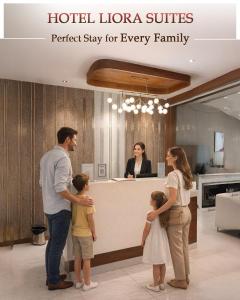 a family standing in front of a hotel lobby at Hotel Liora Suites in Bangalore