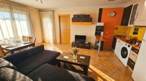 a living room with a couch and a table at Apartment Segura 2BD in Rojales