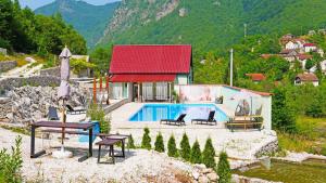 a villa with a swimming pool and a house at Zora - moje mjesto in Konjic