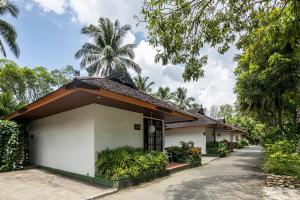 a building with a palm tree in the background at Mesra International Hotel in Samarinda