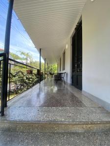 an empty porch of a building with a balcony at Zurkas’ guesthouse in Batumi +5 photos