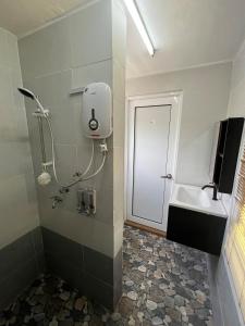 a bathroom with a sink and a toilet and a mirror at Wadi Al Hasyer Homestay Daisy in Juasseh
