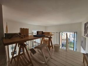 a room with a wooden desk and a chair at Bell' Antonio Sea View in Minori +11 photos