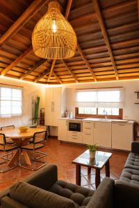 a living room with a couch and a table at La Paredita Casa Guimar in Tanque