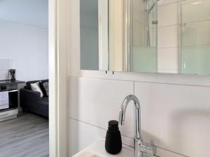 a kitchen with a sink and a faucet at Fewo Diemelsee 4 in Heringhausen +15 photos