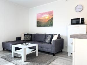 a living room with a couch and a table at Fewo Diemelsee 2 in Heringhausen