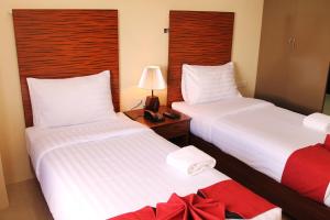 Uma cama ou camas num quarto em Sebastien Hotel
