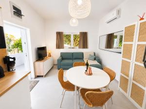 a living room with a table and a couch at Spitaki Almyrida in Almyrida