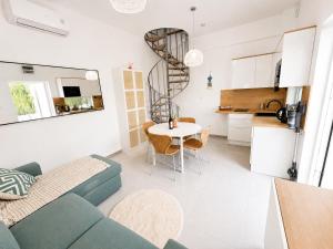 a living room with a blue couch and a table at Spitaki Almyrida in Almyrida