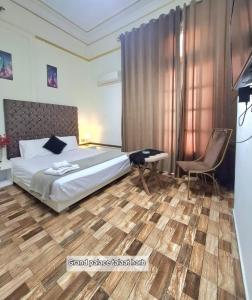 a bedroom with a bed and a desk and a chair at pal ace talaat harb in Cairo +29 photos